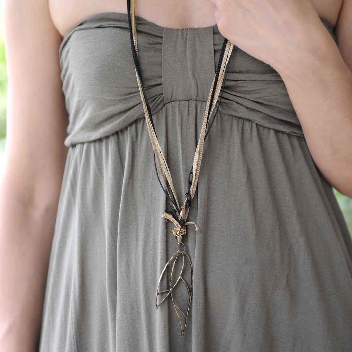 Neckklace with bronze handmade charm and silk ribbons. Designed and made for Bead A Boo jewelry by Katerina Glinou.