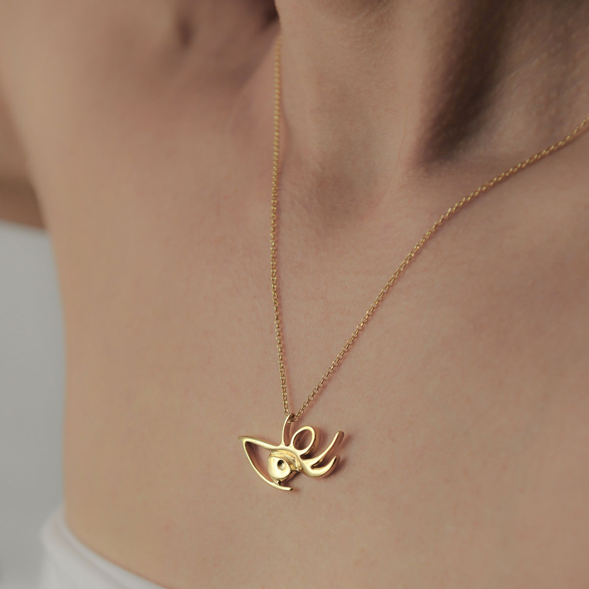 Eye necklace is gold plated silver. Design and handmade for Bead A Boo jewelry by Katerina Glinou.